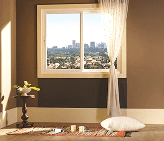 Elegant uPVC sliding window with city view, natural lighting, and modern interior design by Nishan Interio – Contact for Custom Kitchen and Wardrobes in Uttarakhand